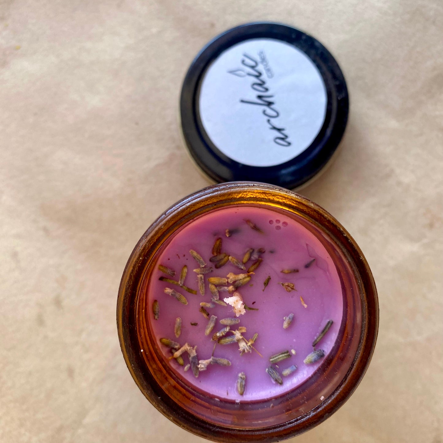 Top view of Luna Calm lavender soy candle with lavender buds, 100 gm, smooth surface for 24-hour burn