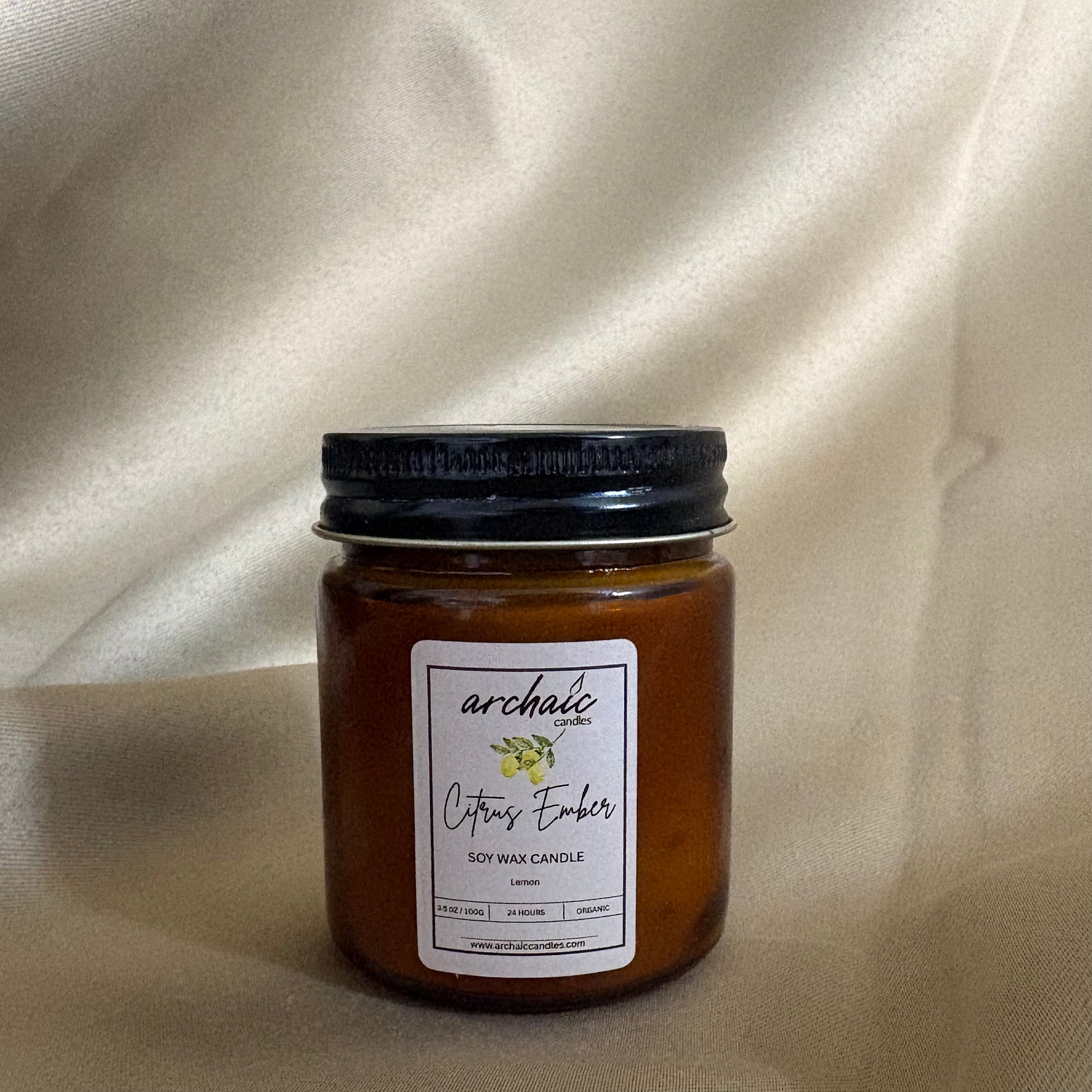 Close-up of cotton wax-braided wick on Citrus Ember lemongrass soy candle, 100 gm