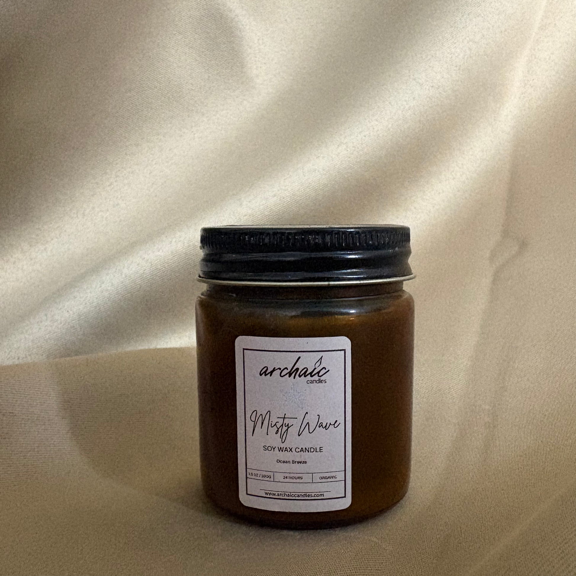 Close-up of cotton wax-braided wick on Misty Wave ocean breeze soy candle, 100 gm