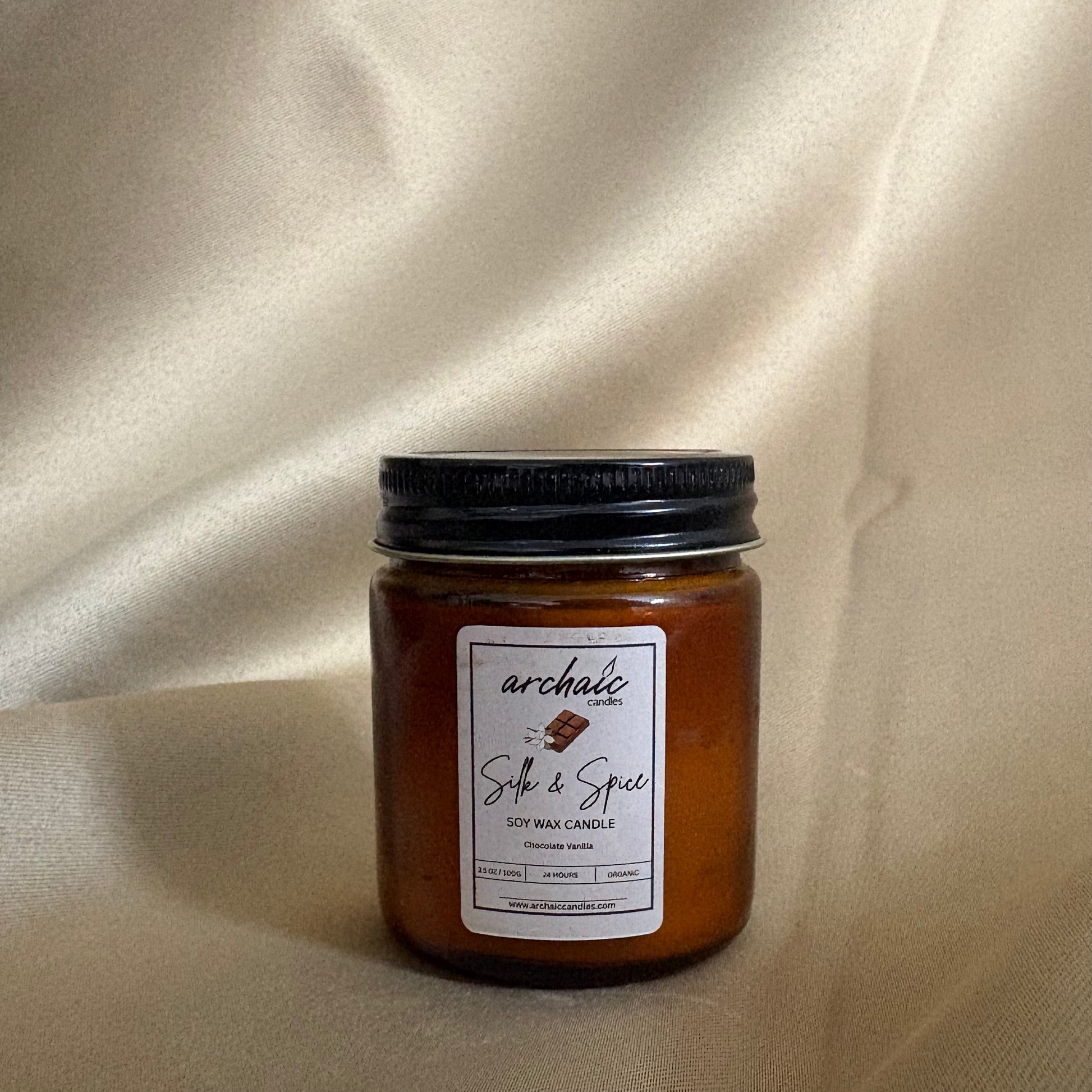 Close-up of cotton wax-braided wick on Silk & Spice chocolate soy candle, 100 gm