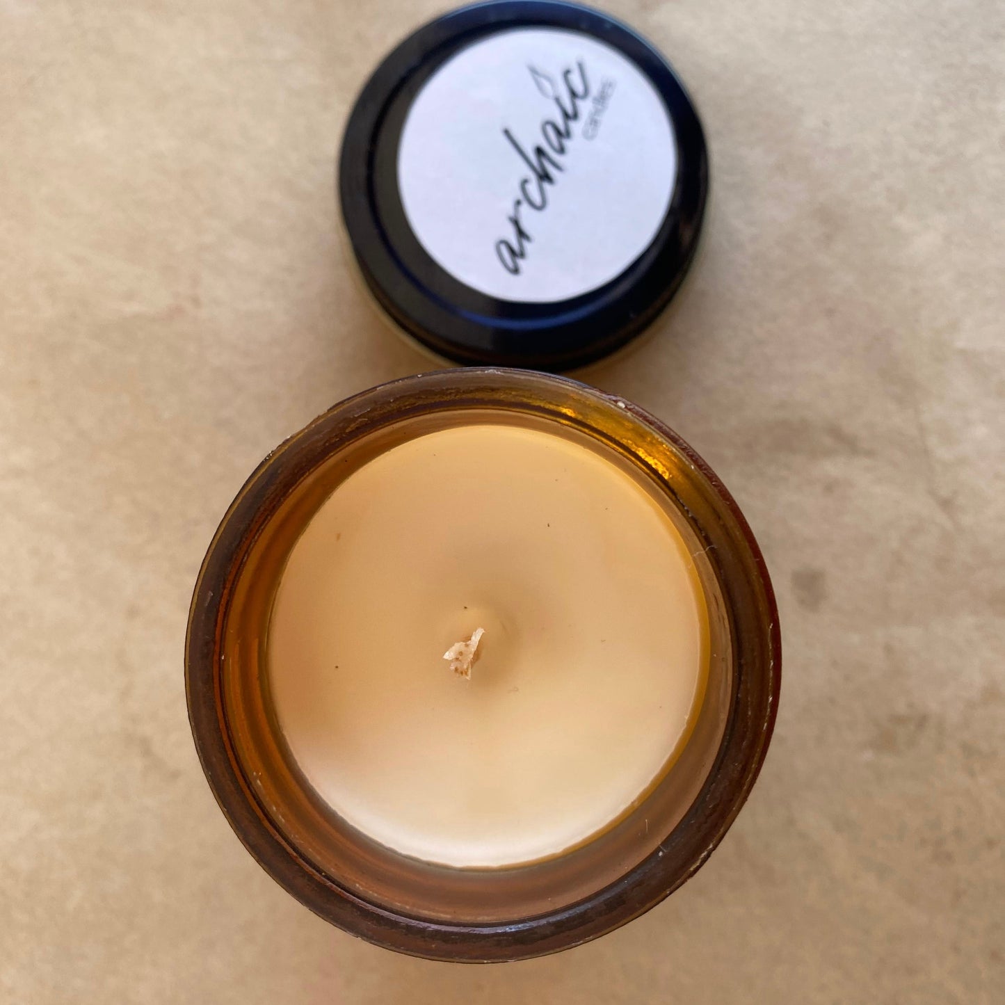 Top view of Silk & Spice chocolate truffle soy candle in amber glass, 100 gm, smooth 24-hour burn surface