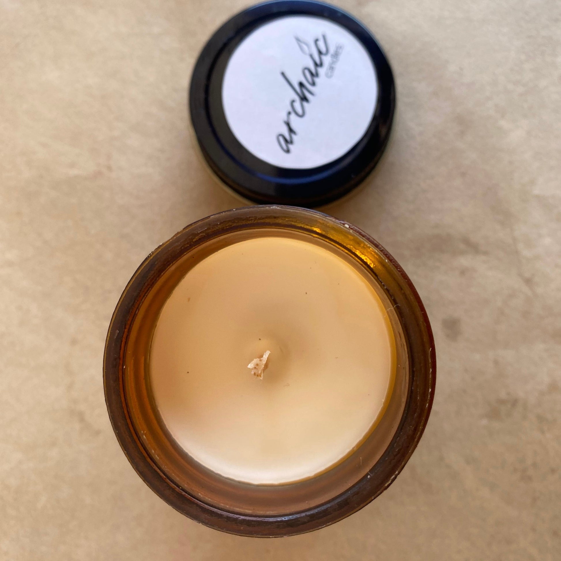 Top view of Silk & Spice chocolate truffle soy candle in amber glass, 100 gm, smooth 24-hour burn surface