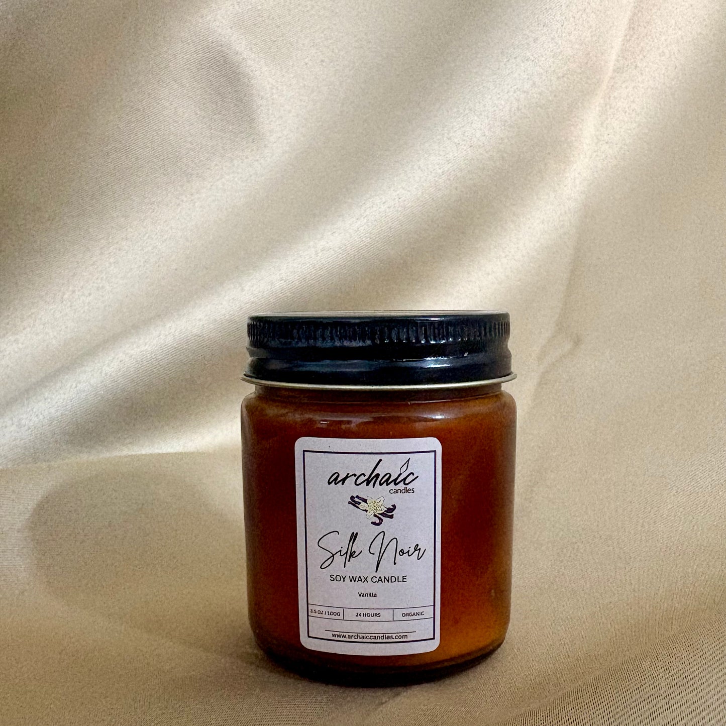 Close-up of cotton wax-braided wick on Silk Noir vanilla soy candle, 100 gm