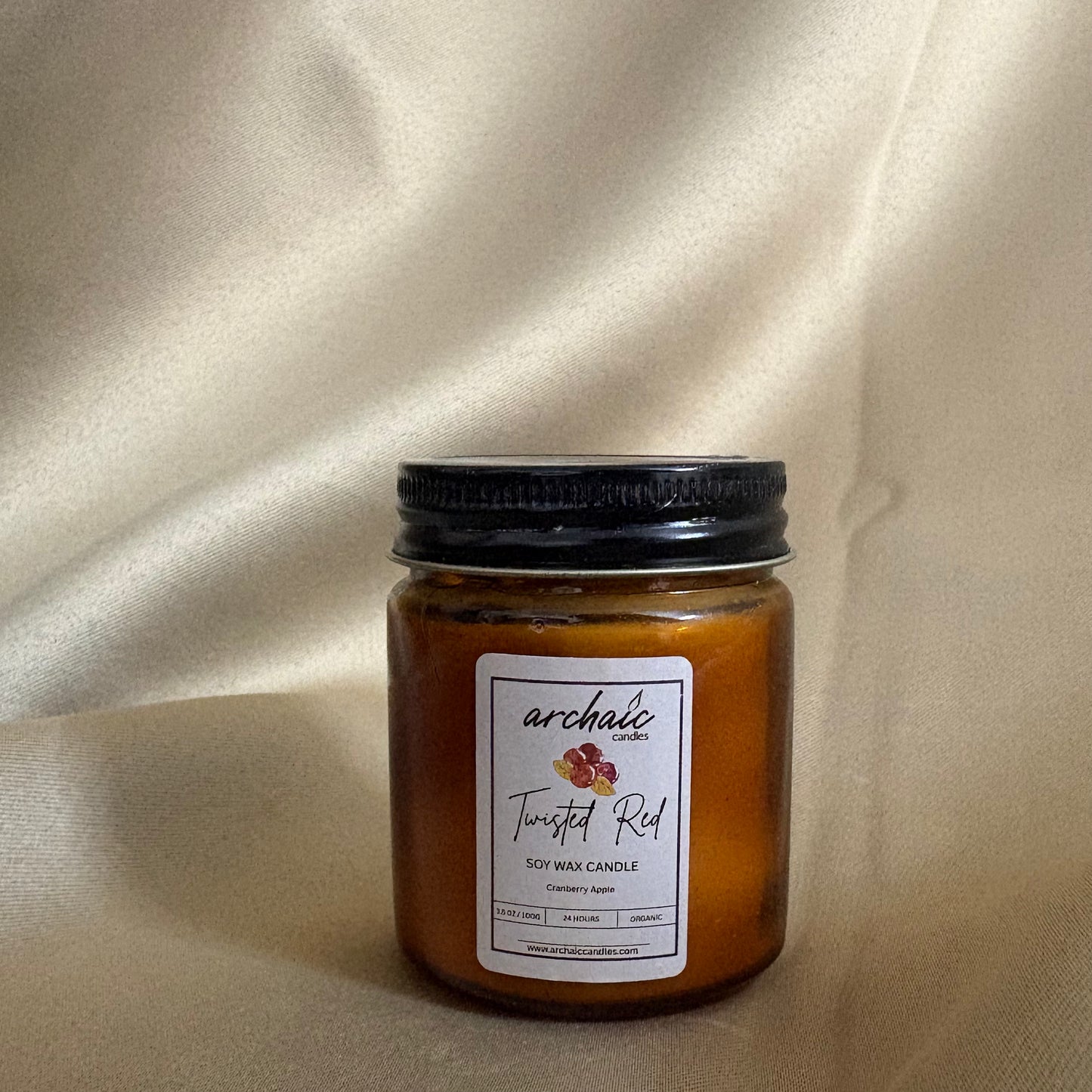 Close-up of cotton wax-braided wick on Twisted Red cranberry apple soy candle, 100gm