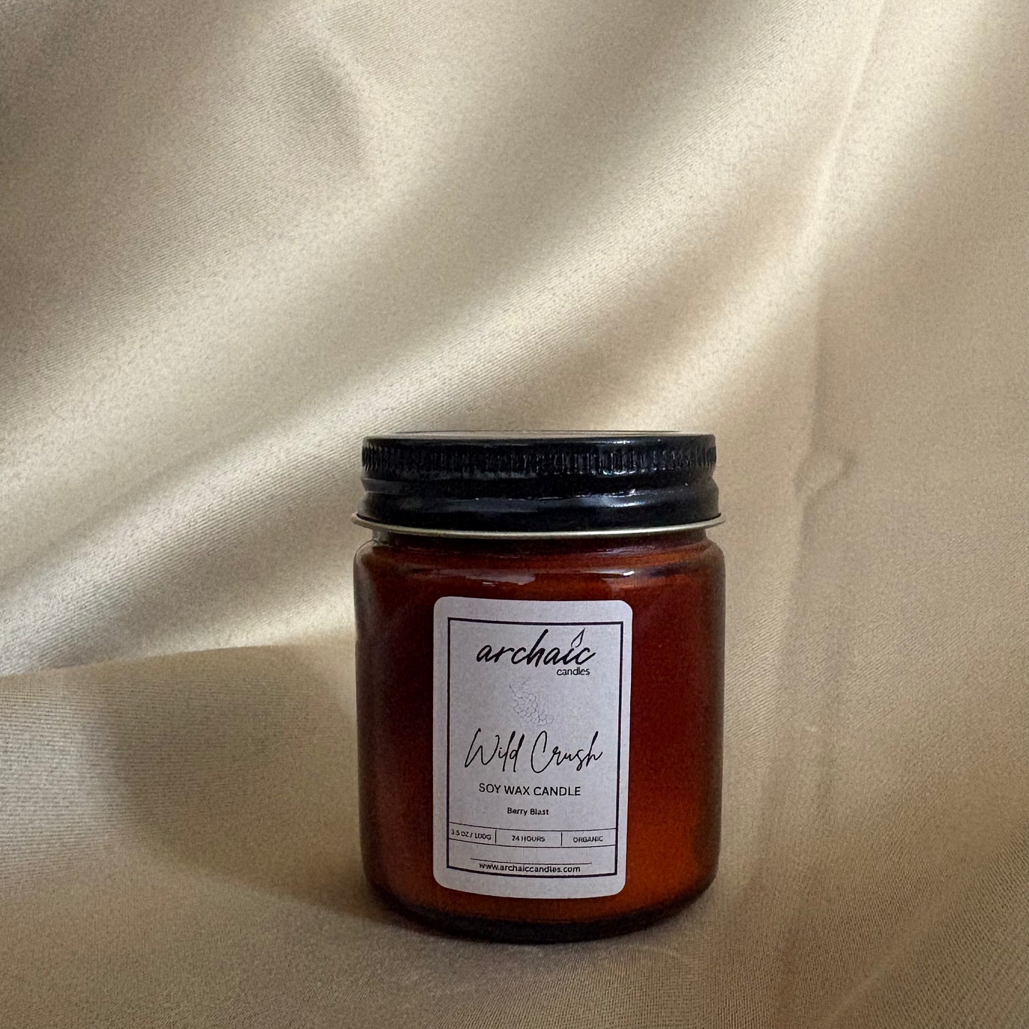 Close-up of cotton wax-braided wick on Wild Crush Berry Blast candle